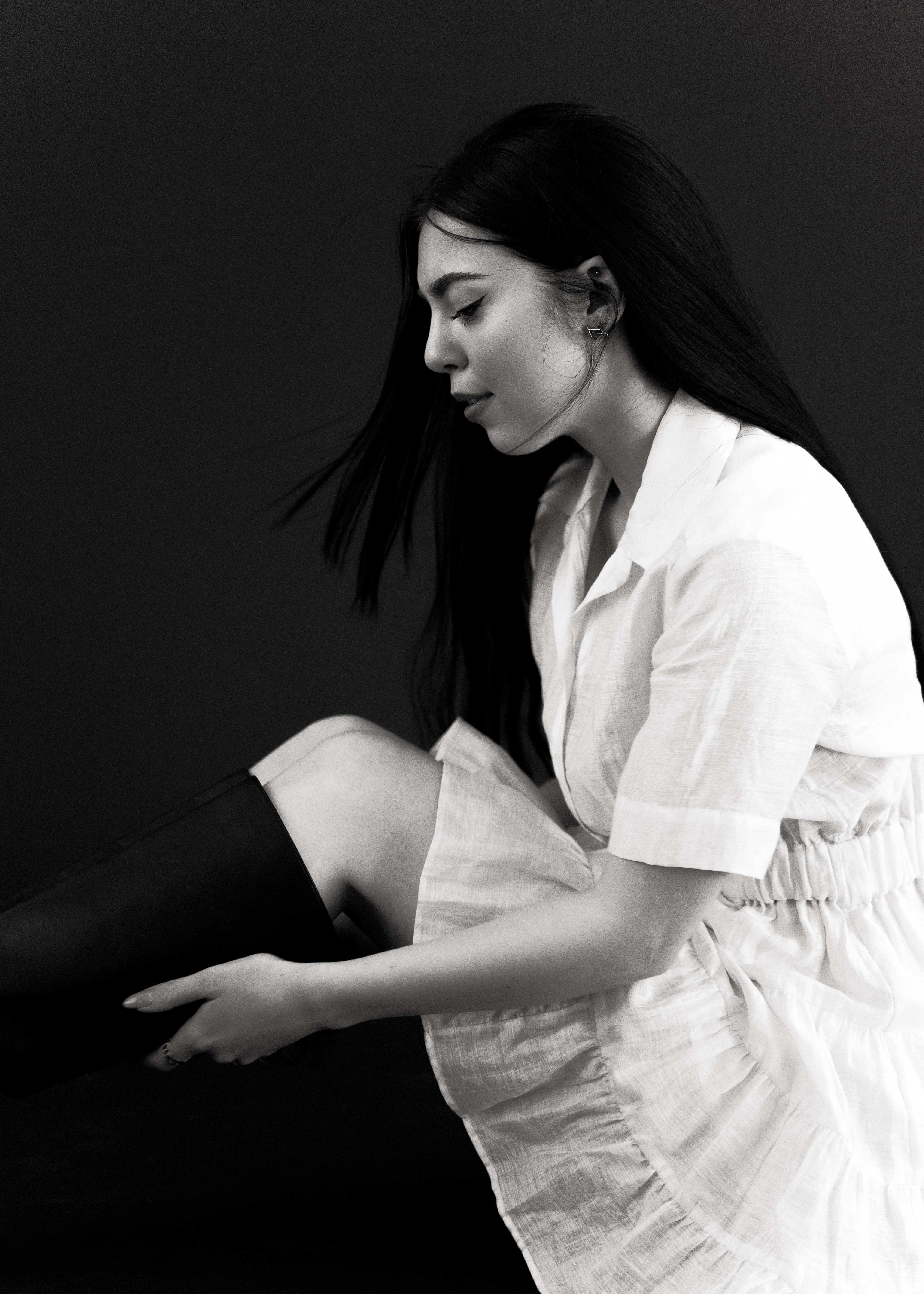 Black and white portrait of woman in white linen shirt